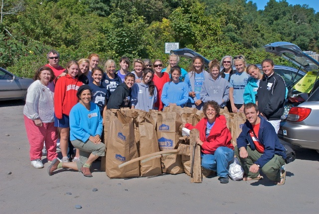 RIrpcvs join with Narragansett soccer team to clean the beach.